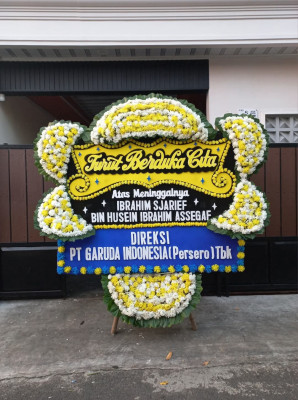 Papan Bunga Duka di Tengah Ilir